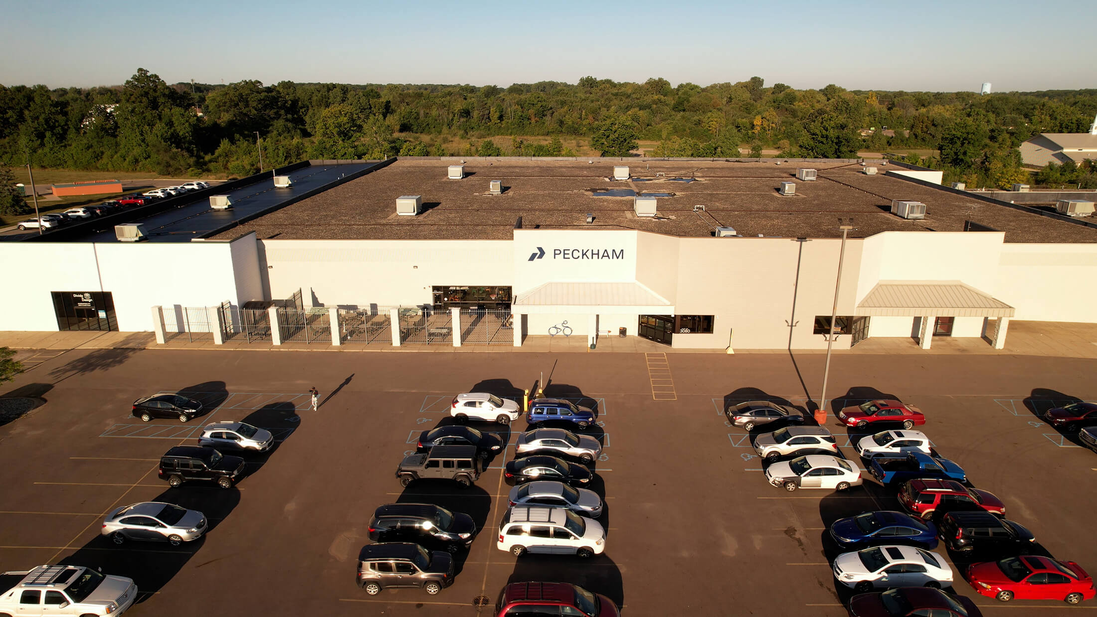 exterior drone shot of the exterior of Peckham buildings and parking lot